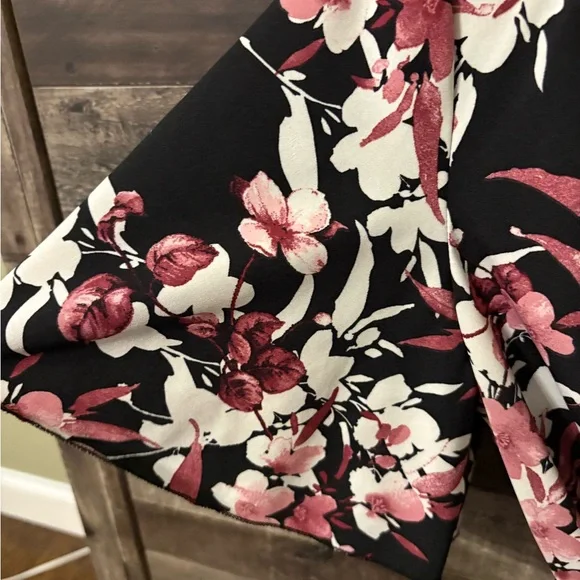 Black Floral Wrap Romper with Pink and Cream Blooms - Picture 2 of 5